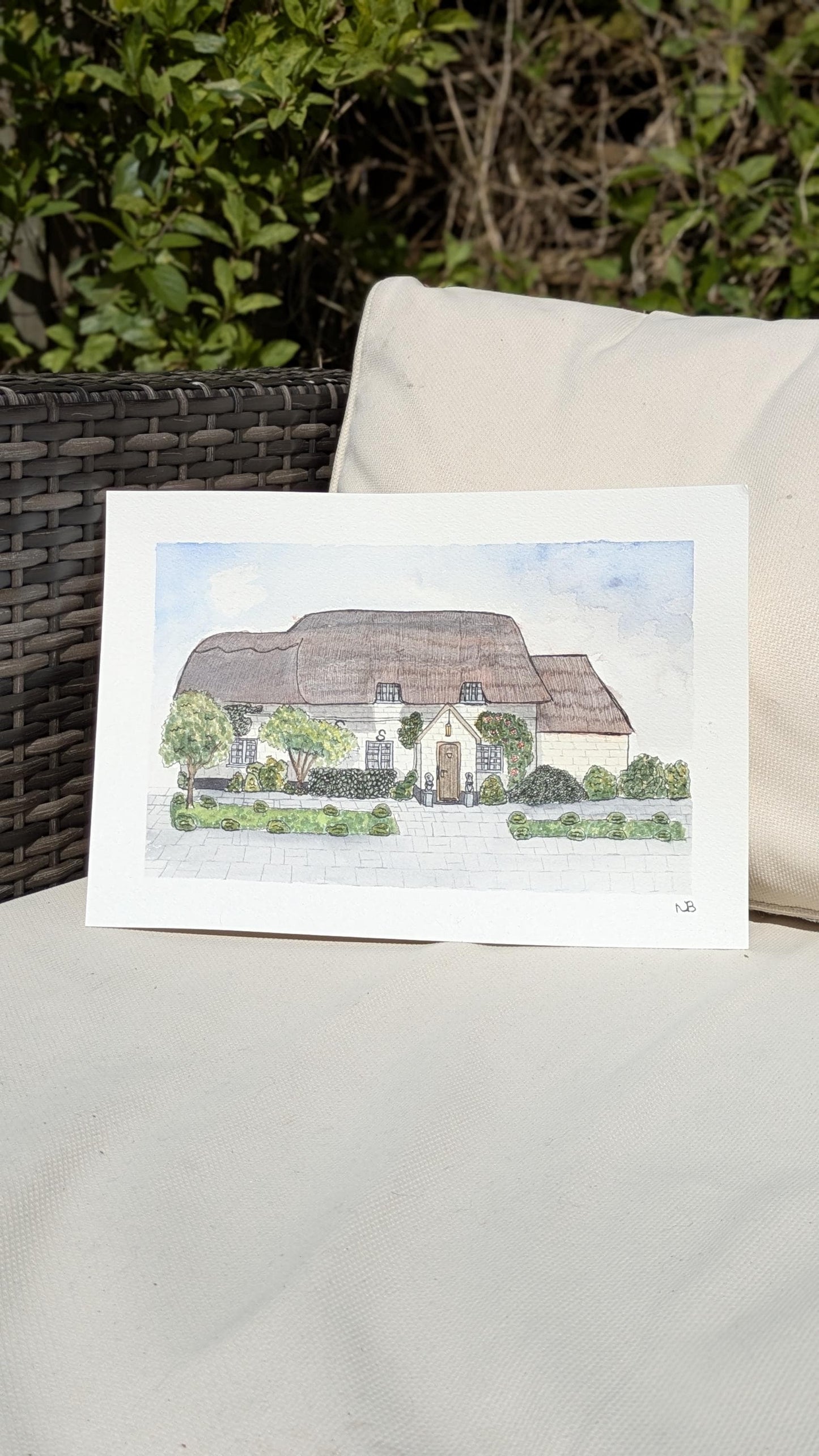 painting of a cottage with a thatched roof