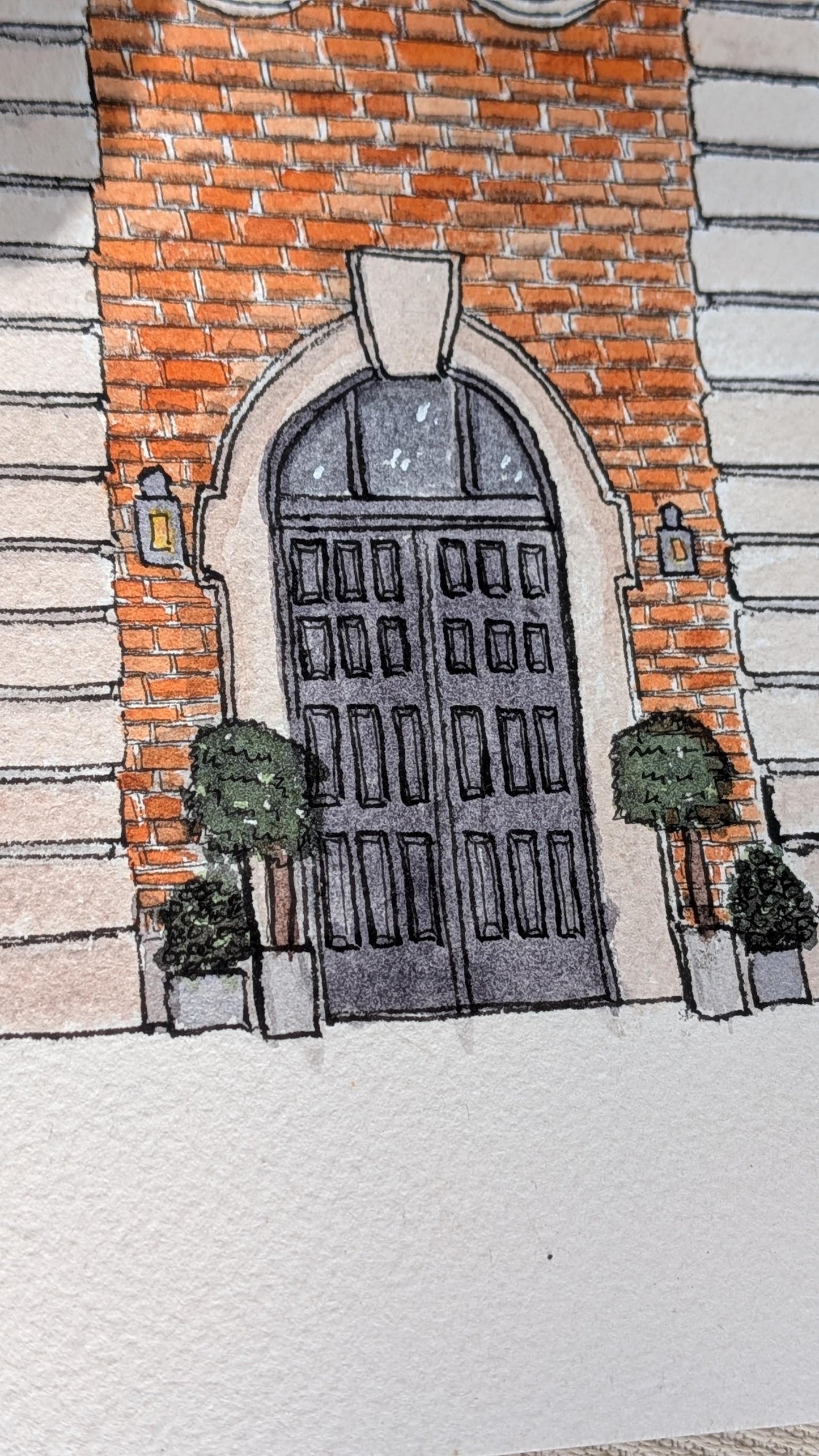 a painting of a black door of a large red brick wedding venue