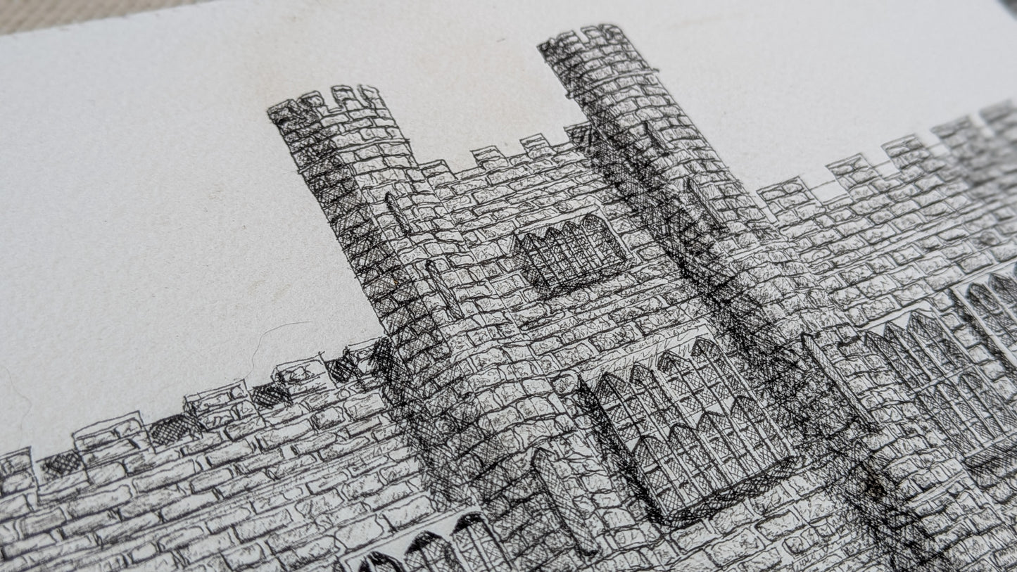 Close-up of a detailed stone wall drawing on paper
