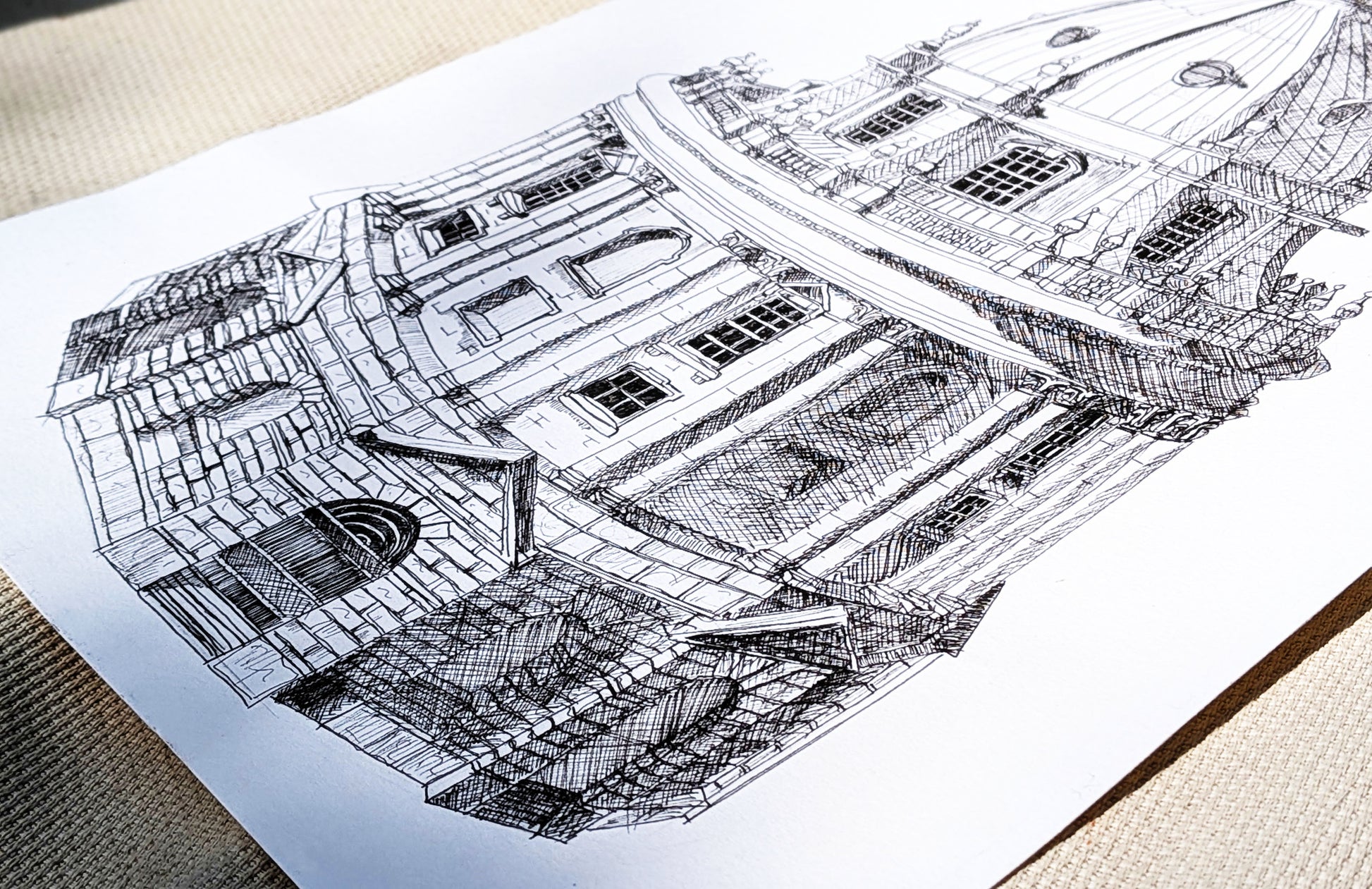 Detailed architectural drawing of a building on a white sheet of paper.