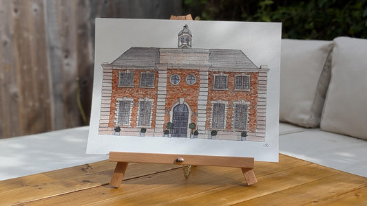 a watercolour painting of a large red brick wedding venue