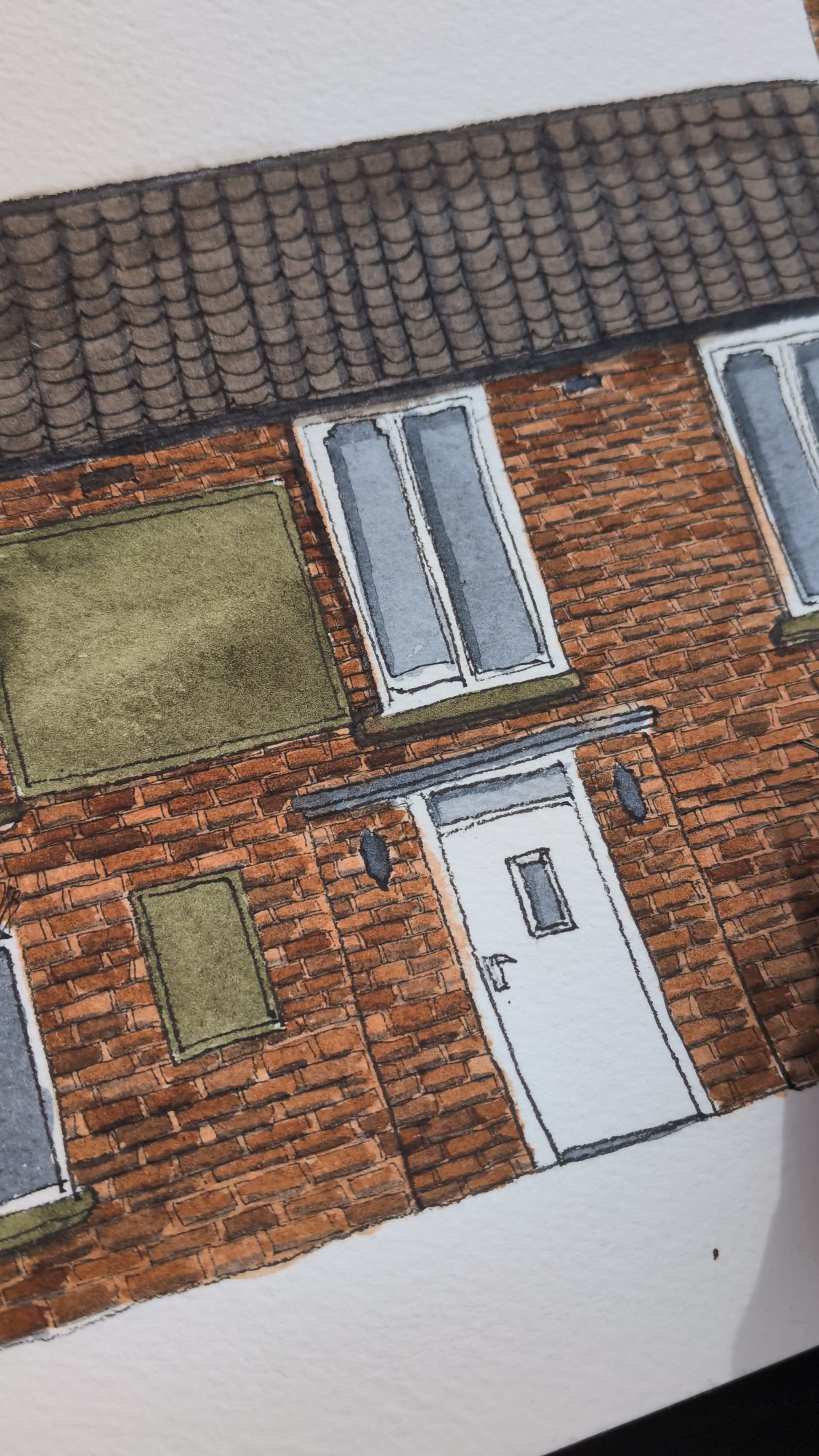 video showing artist adding fine liner texture to a red bricked building illustration