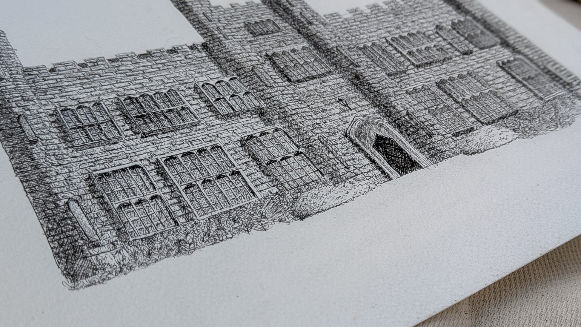 Detailed black and white architectural drawing on a textured surface