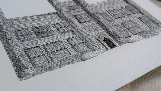 Detailed black and white architectural drawing on a textured surface